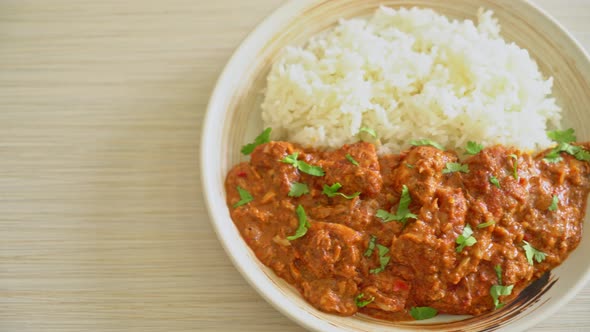 chicken tikka masala with rice on plate - Indian food style alt