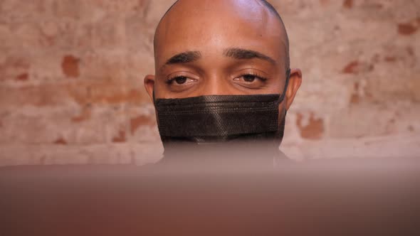 Black Businessman Using Laptop for Analyzing Data Stock Market Stock Exchange Trading Online alt