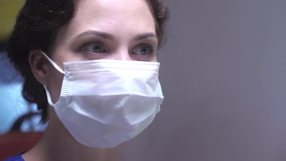 Woman's Face in Respiratory Mask Look at Somethig. alt