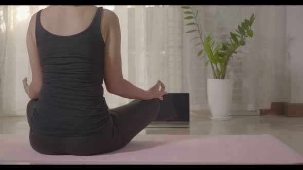 Woman teaching yoga online first step is meditation zen for working out alt