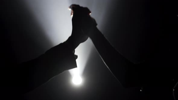 Man and Woman Palms Holding Together on Black Background