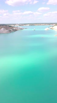 Two girls and two men are standing on the top of a mountain in chalk quarries alt