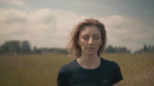 Runner Girl In Sportswear Training For Triathlon. Hair Blowing When Triathlete Girl Running. alt