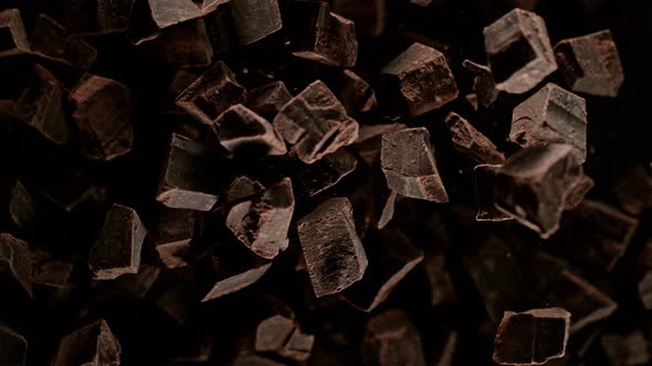Super Slow Motion Shot of Raw Chocolate Chunks After Being Exploded Towards The Camera at 1000Fps alt