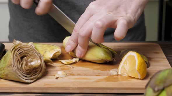 Woman Cut Artichoke alt