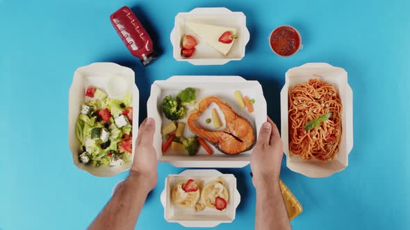 Food Delivery Top View Take Away Meals in Disposable Containers on Blue Background alt