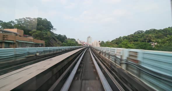 Monorail train moving though the city alt