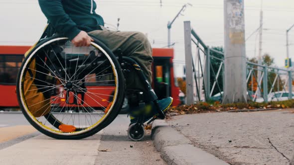 Disabled Man in Wheelchair Makes Attempt To Climb a Step - Another People Help Him alt