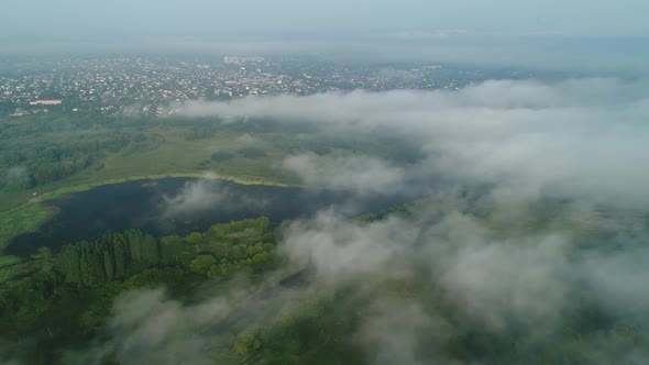 Flight Over the Clouds That Fly Away and Open the Landscape of the City