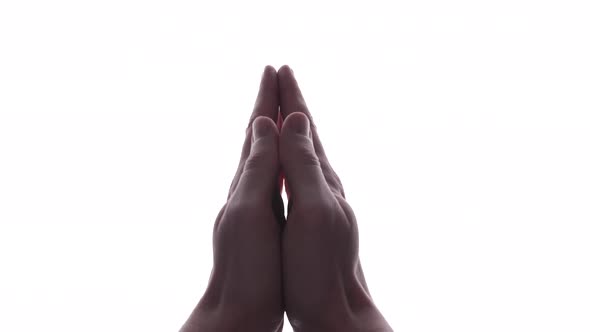 Person does hand gesture with bright white backdrop 39 alt