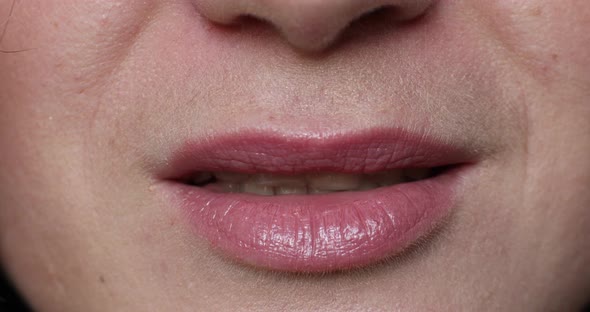 Woman's Lips Kissing in Close-up