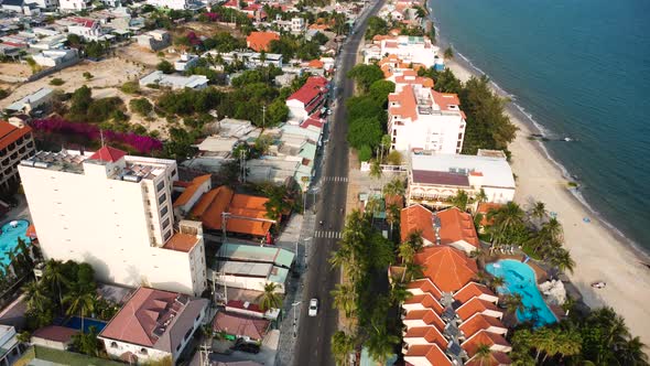 Luxury waterfront hotels in Mui Ne tourist resort, Vietnam, aerial panorama alt