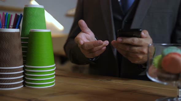 Hands of Barista Serving Customers at Coffee Shop