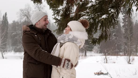 Child Interrupting Diverse Spouses Hugging Outdoors alt