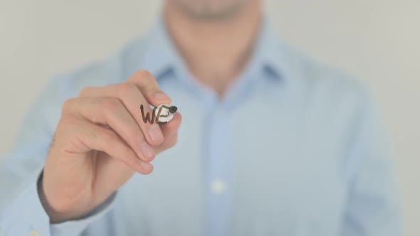 We Make it Better, Man Writing on Transparent Screen alt