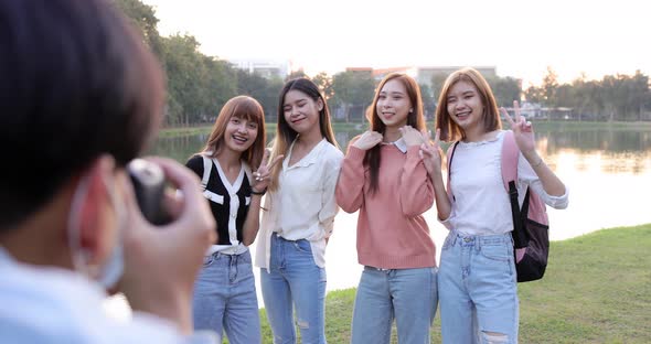 Group of Asian girl friends are smiling, greeting and enjoying front of camera. alt