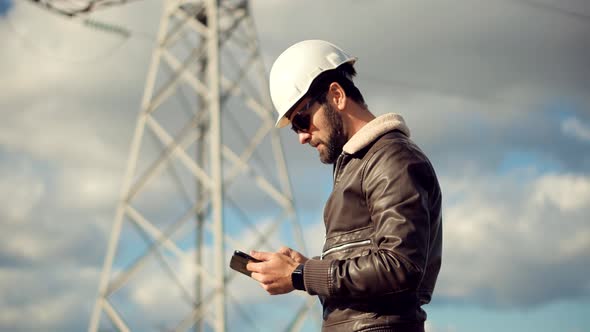Electrical Engineer In Hard Hat.Foreman Developer Checking Construction.Architect In Hardhat Helmet alt