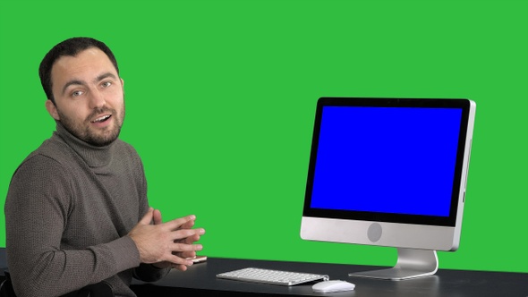 Casual businessman smiling and talking at the camera showing alt