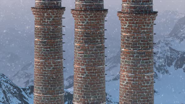 Brick Chimney on the Against the Backdrop of a Snowy Mountain Landscape alt