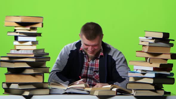 Guy That Reads and Writes Data To the Notebook Itself. Green Screen. Time Lapse alt