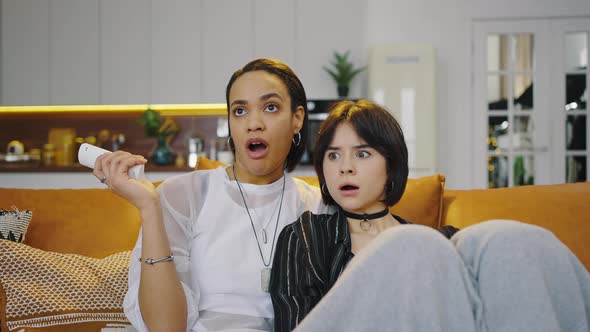 Portrait of Multiracial Homosexual Couple at Home on the Couch alt