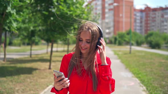 Girl listening to music in headphone. Attractive young woman listening to music in headphone alt