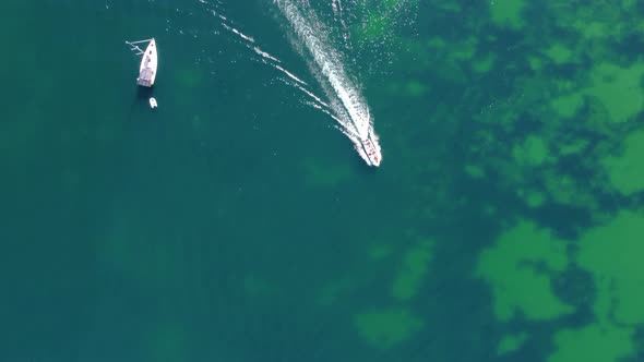 Aerial drone view of boats and kayaks in the Atlantic Ocean. Travel and adventure. Vibrant colors.