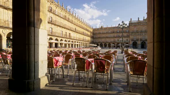 Walking the Cafe with Pink Tables and Wicker Chairs at Plaza Mayor in Salamanca, Spain. Salamanca Is alt