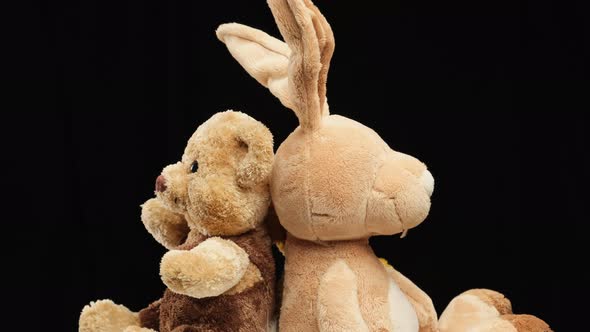 rabbit with long ears and various teddy bears rotates