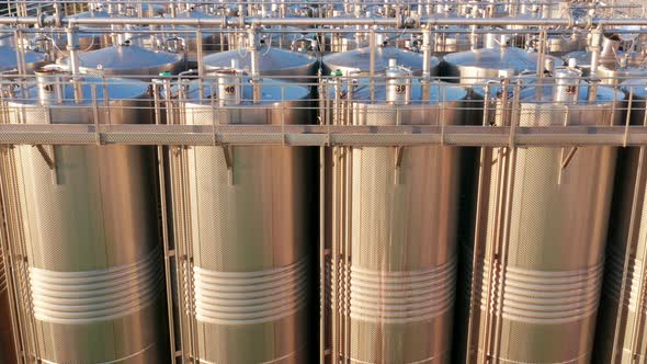 Shiny silos in a chemical factory - stainless steel containers in chemical industry plant alt