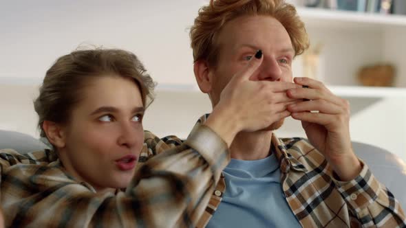 Wife Watching Movie Husband on Weekend Closeup alt