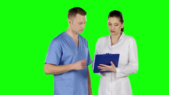 Two Doctors Explaining About Patient. Green Screen alt