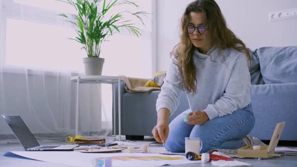 Woman Draws in Spacious Interior at Home