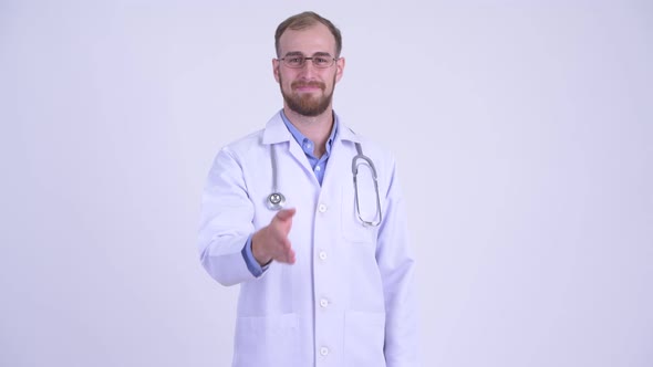 Happy Bearded Man Doctor Giving Handshake