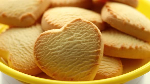 a Bunch of Heartshaped Cookies on a Yellow Plate Rotate in a Circle