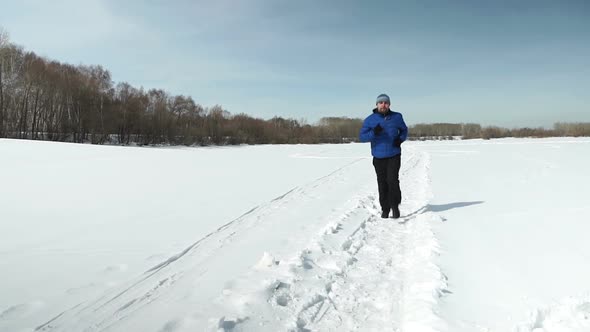 Young Man Is Running In A Sunny Day In Winter alt
