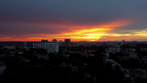 Epic aerial sunset in city residential district