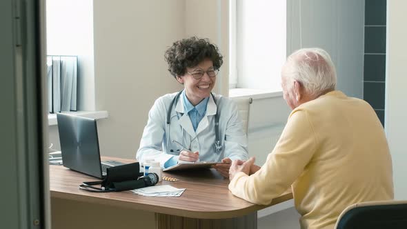 Doctor consulting elderly man