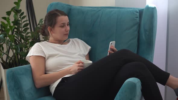 Authentic Young Woman Chatting On Phone In Living Room
