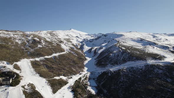 Ski resort in Sierra Nevada, Spain. Aerial backward and Sky for copy space