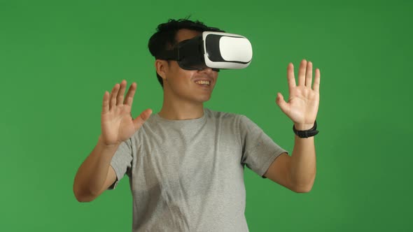 Asian Man Working In Virtual Reality alt