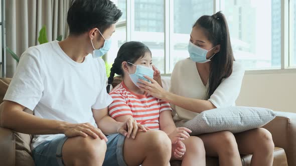 asian healthy wellness family wearing surgical facial mask together and stay home alt