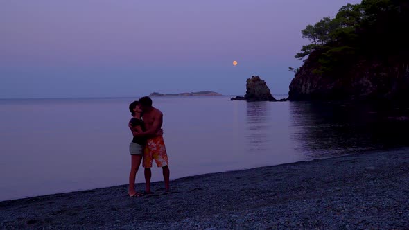 Man and Woman on the Beach at Night alt