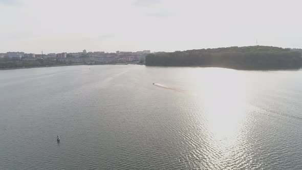 Aerial view of boat racing alt