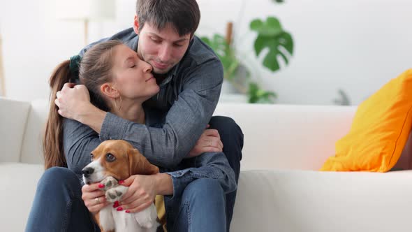 Young Family Couple with Dog Man Hugs Beloved Girlfriend Spbi alt