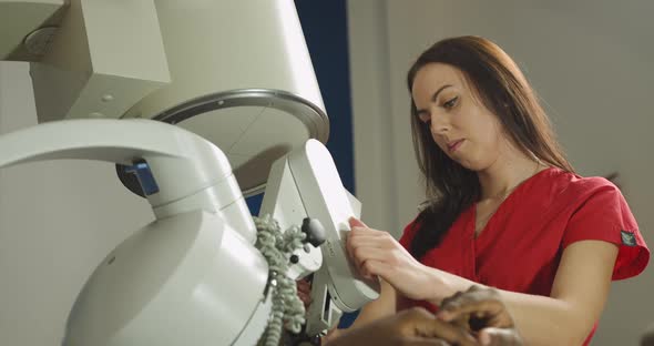 Close Up of Pretty Caucasian Woman Doctor Providing Stone Treatment for Black alt