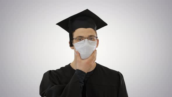 Graduate Student in a Medical Mask Walking on Gradient Background alt
