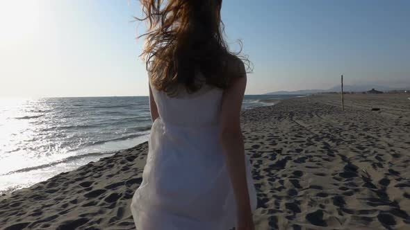 Girl Runs Along the Beach