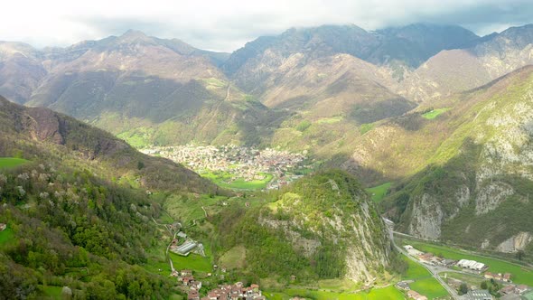 Aerial Video of the Small Town of Pasturo in Lombardy North Italy Showing Mountain Panorama Forest alt