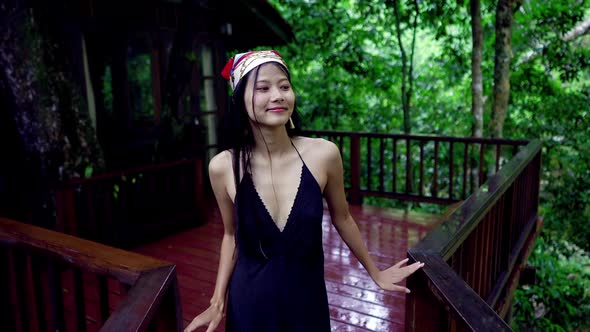 Cute Smiling Asian Girl Walking on a Bridge By Treehouse Slow Motion Thailand